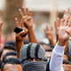 Cairo University students shout slogans against the government and flash the 'V' and Rabaa signs after the verdict of former Egyptian President Hosni Mubarak's trial, at the university's campus in Giza